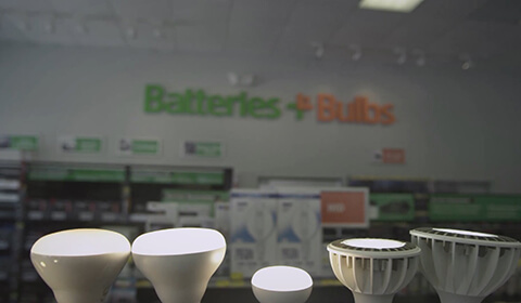 Photograph: Interior shot of Batteries+Bulbs store with various lightbulbs in foreground