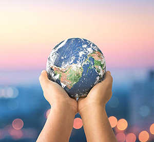 Hands holding globe