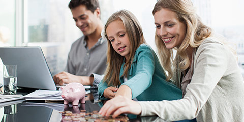 Mother and daughter counting coins.