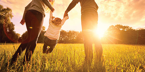 Family walking through field.