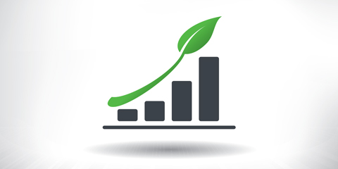 Green leaf atop a bar chart.