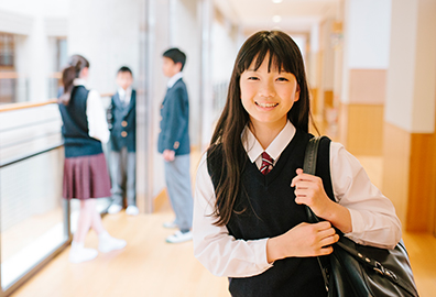 Female student standing in school hallway