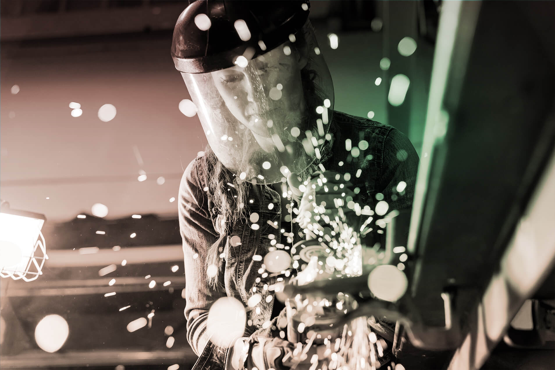 Photograph of female welder working.