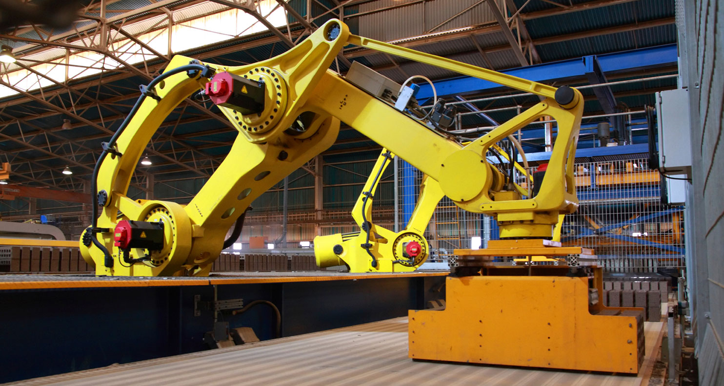Robotic arm towering over conveyor belt